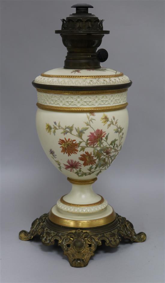 A Royal Worcester floral painted blush ground oil lamp height 42cm